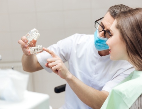 Dentist and dental patient discussing one visit dental restorations