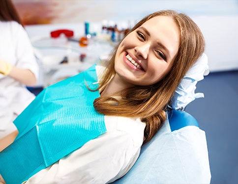 Woman smiling after root canal treatment