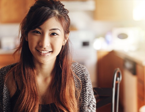 Young woman sharing healthy smile after wisdom tooth extractions