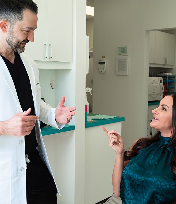 Dentist and patient talking during preventive dentistry visit