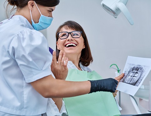 Dentist examining patient's teeth
