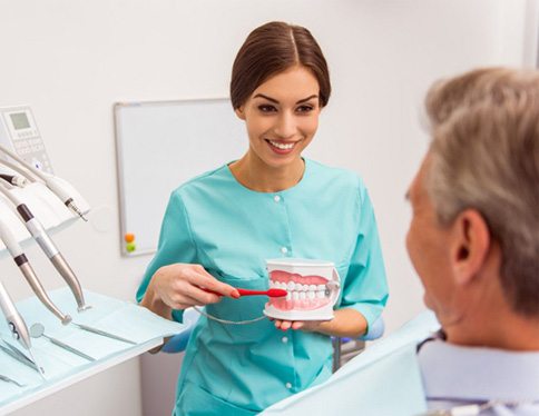 a patient visiting his dentist for dentures