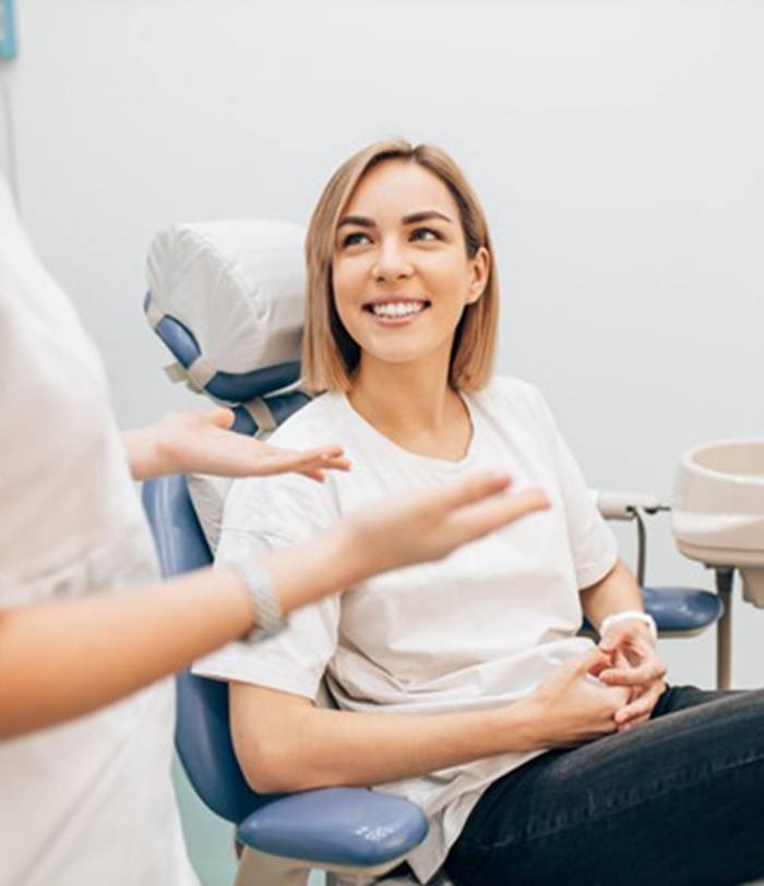 a patient visiting their dentist in San Juan Capistrano for tooth extractions