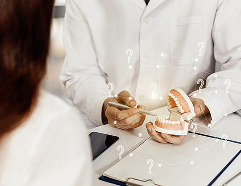 A dentist answering a patient’s questions