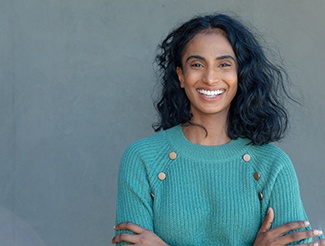 Woman smiling with dental implants in San Juan Capistrano