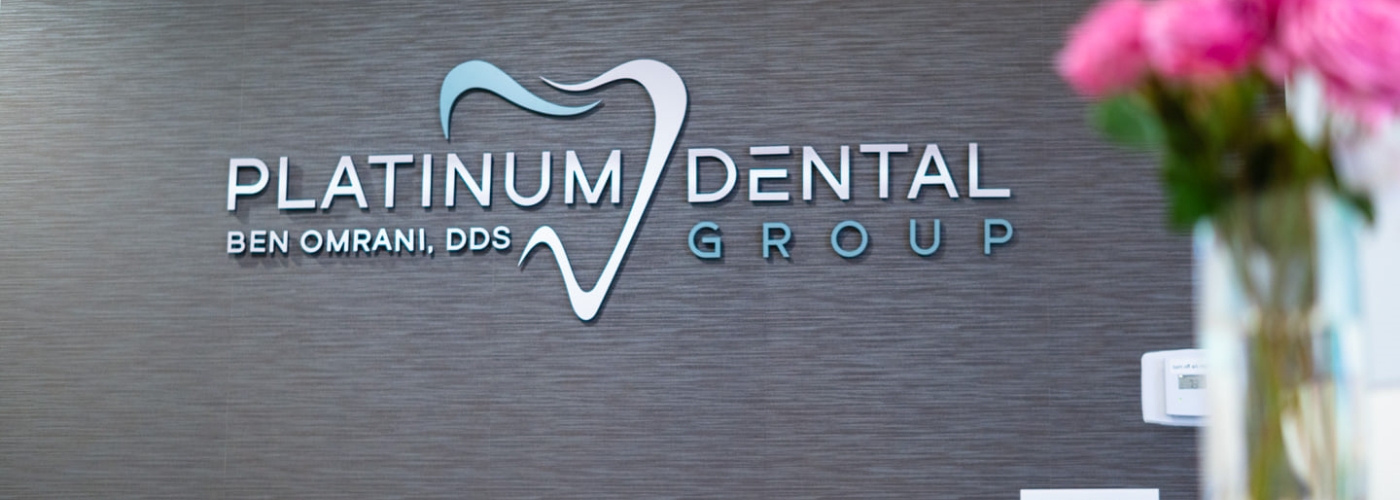 Platinum Dental Group sign on dental office wall San Juan Capistrano