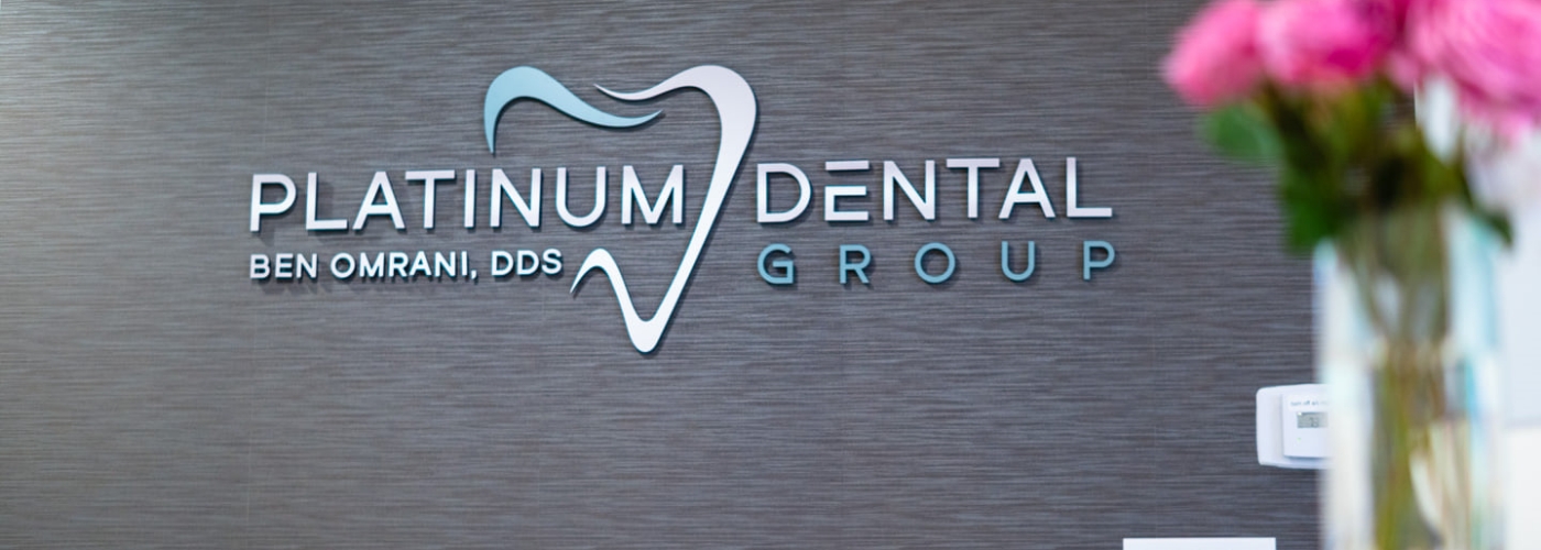 Platinum Dental Group of San Juan Capistrano sign on dental office wall