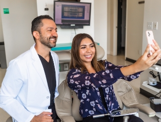 Dentist and patient taking a picture together in San Juan Capistrano