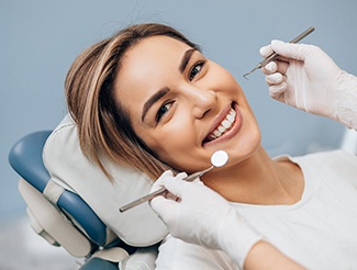 Woman smiling during dental checkup