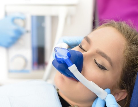 Dental patient receiving treatment under nitrous oxide dental sedation