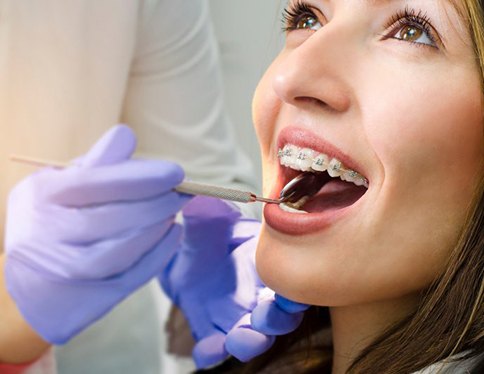 Lady receives orthodontic checkup?