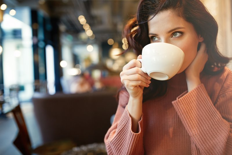 Young woman drinking coffee