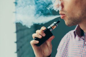 Man vaping CBD oil